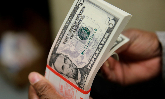 A packet of U.S. five-dollar bills is inspected at the Bureau of Engraving and Printing in Washington